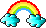 kleiner voller Regenbogen zwischen 2 blauen Wolken